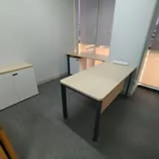 L-shaped office desk and storage cabinet installed in Singapore office
