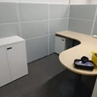 Completed desk assembly with storage in a Singapore office